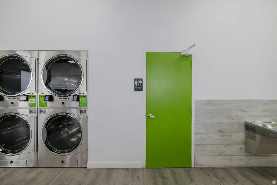 Laundry room featuring stacked washer and dryer
