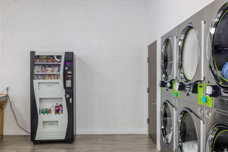 Laundry room featuring wood finished floors and baseboards