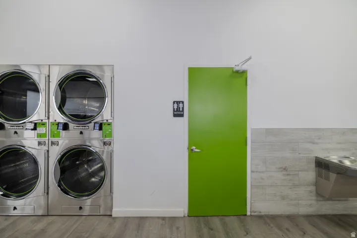 Laundry room featuring stacked washer and dryer