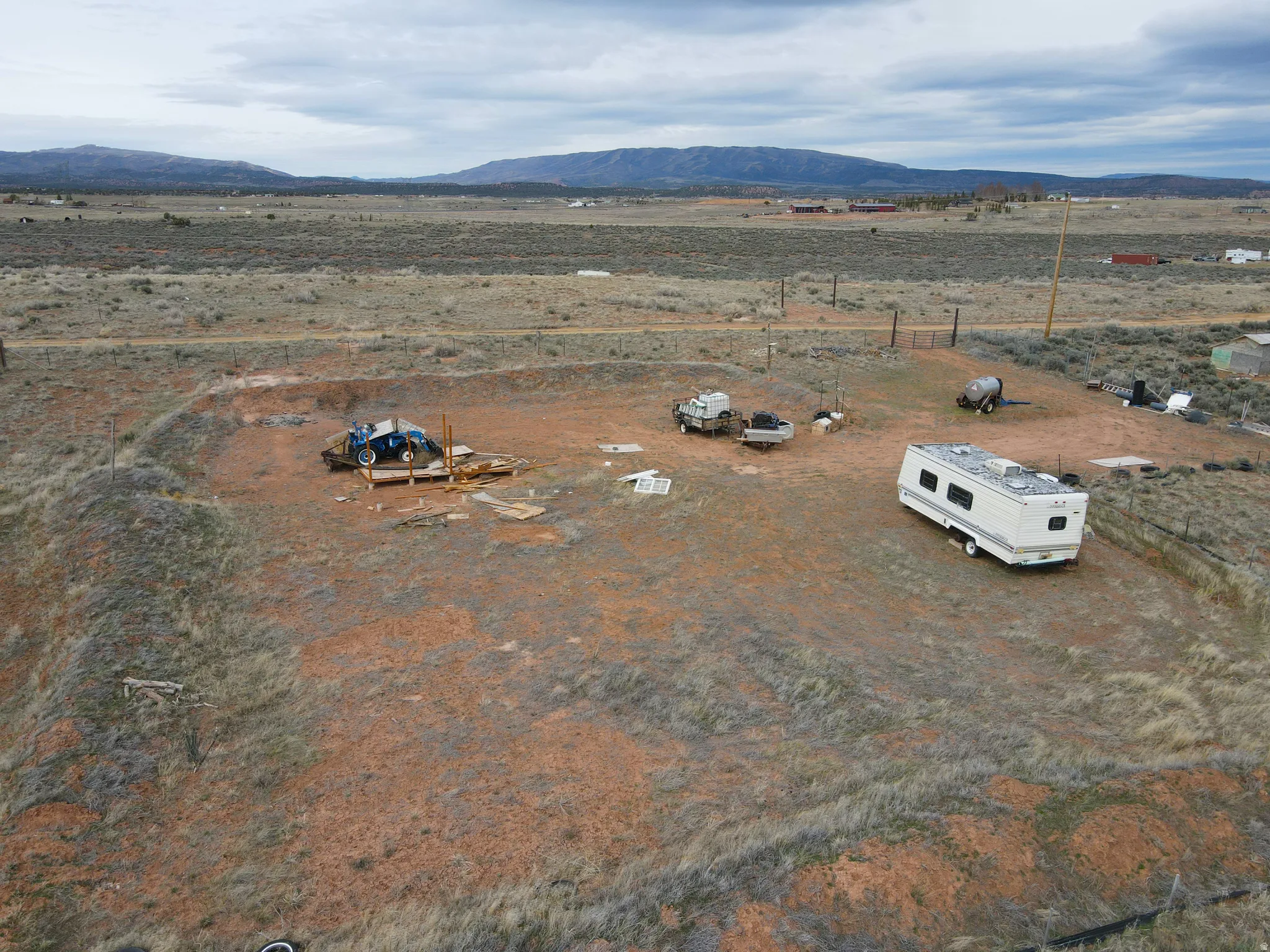 View of rural area featuring a mountainous background and a desert landscape