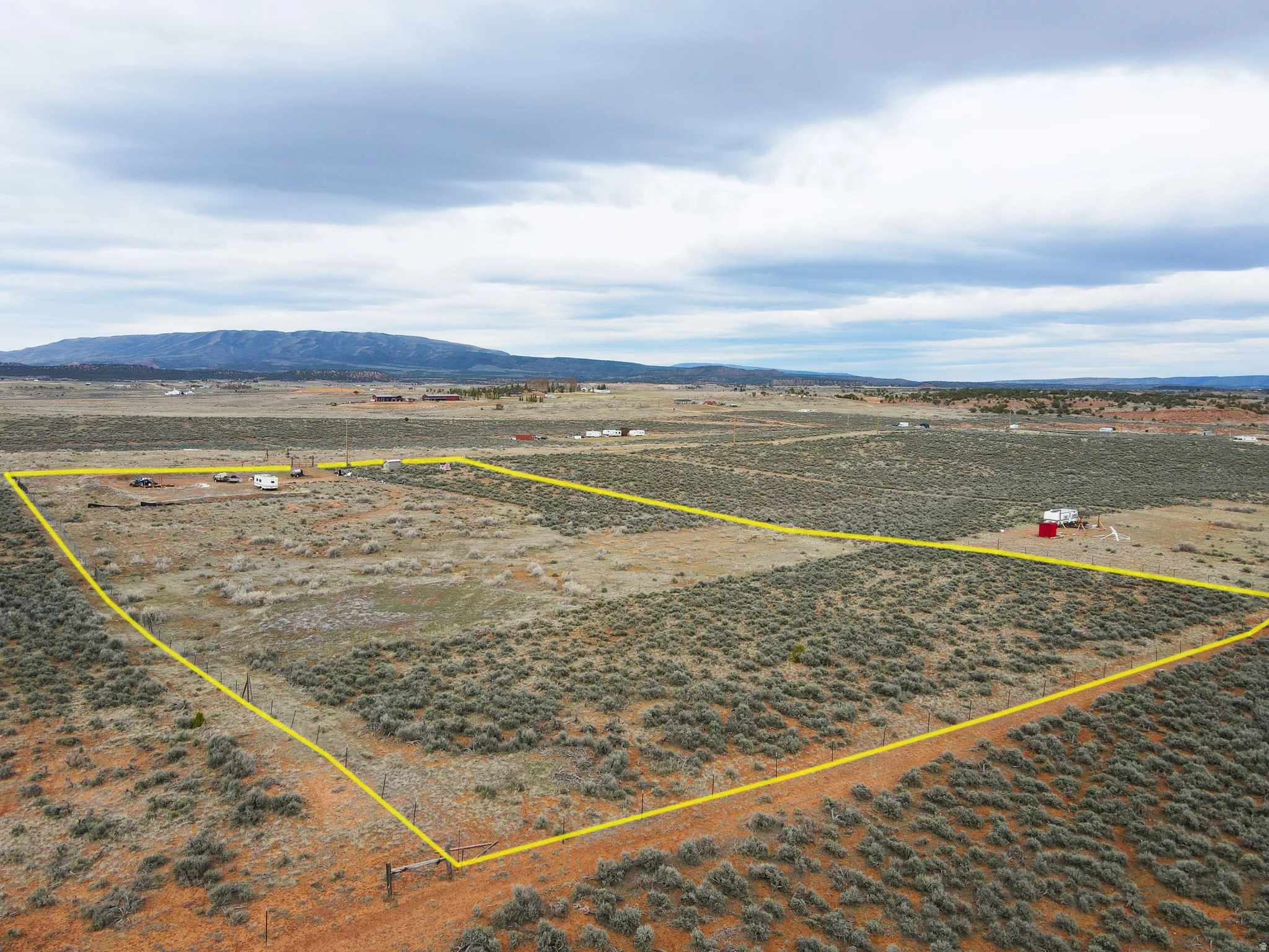 Overview of rural landscape featuring mountains and property boundaries highlighted