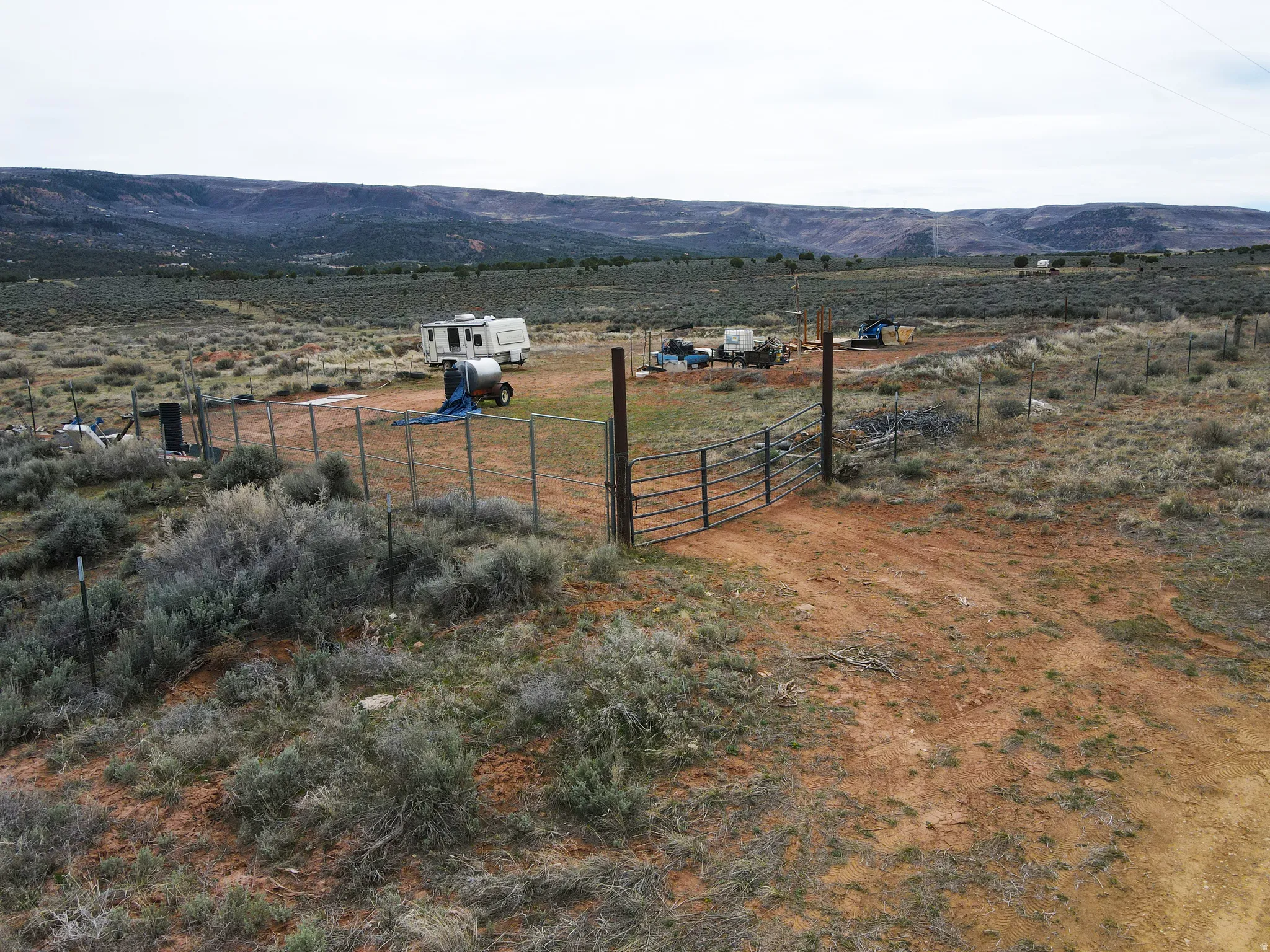 View of mountain backdrop with rural landscape