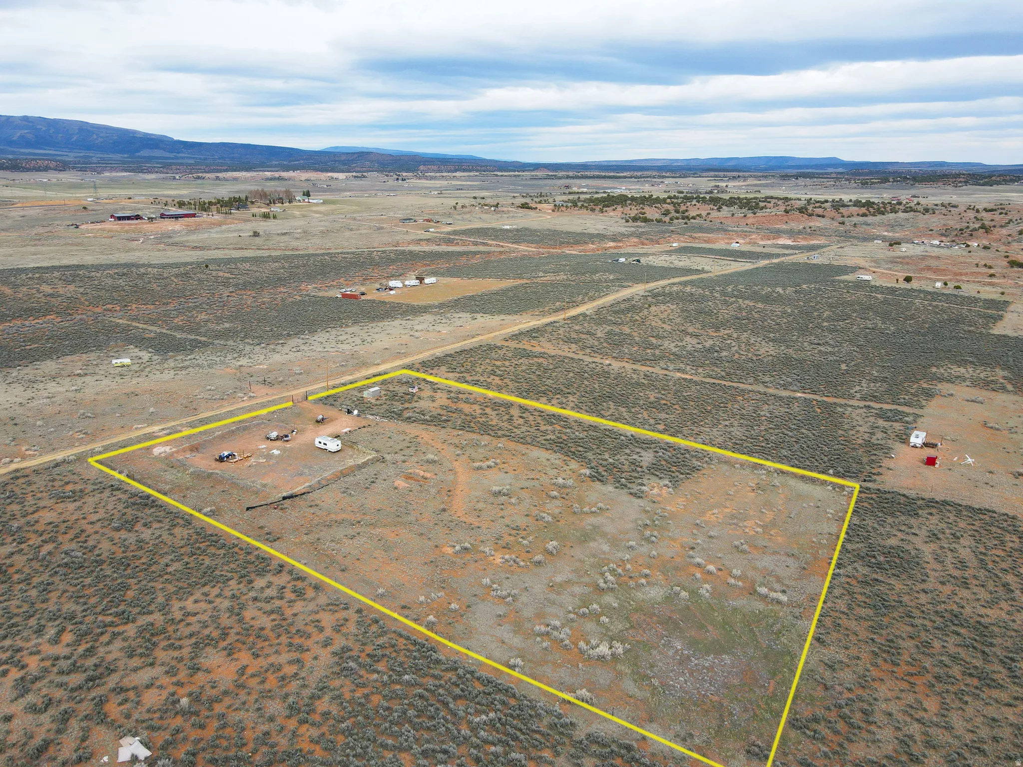 View of rural area with a mountainous background and property parcel outlined