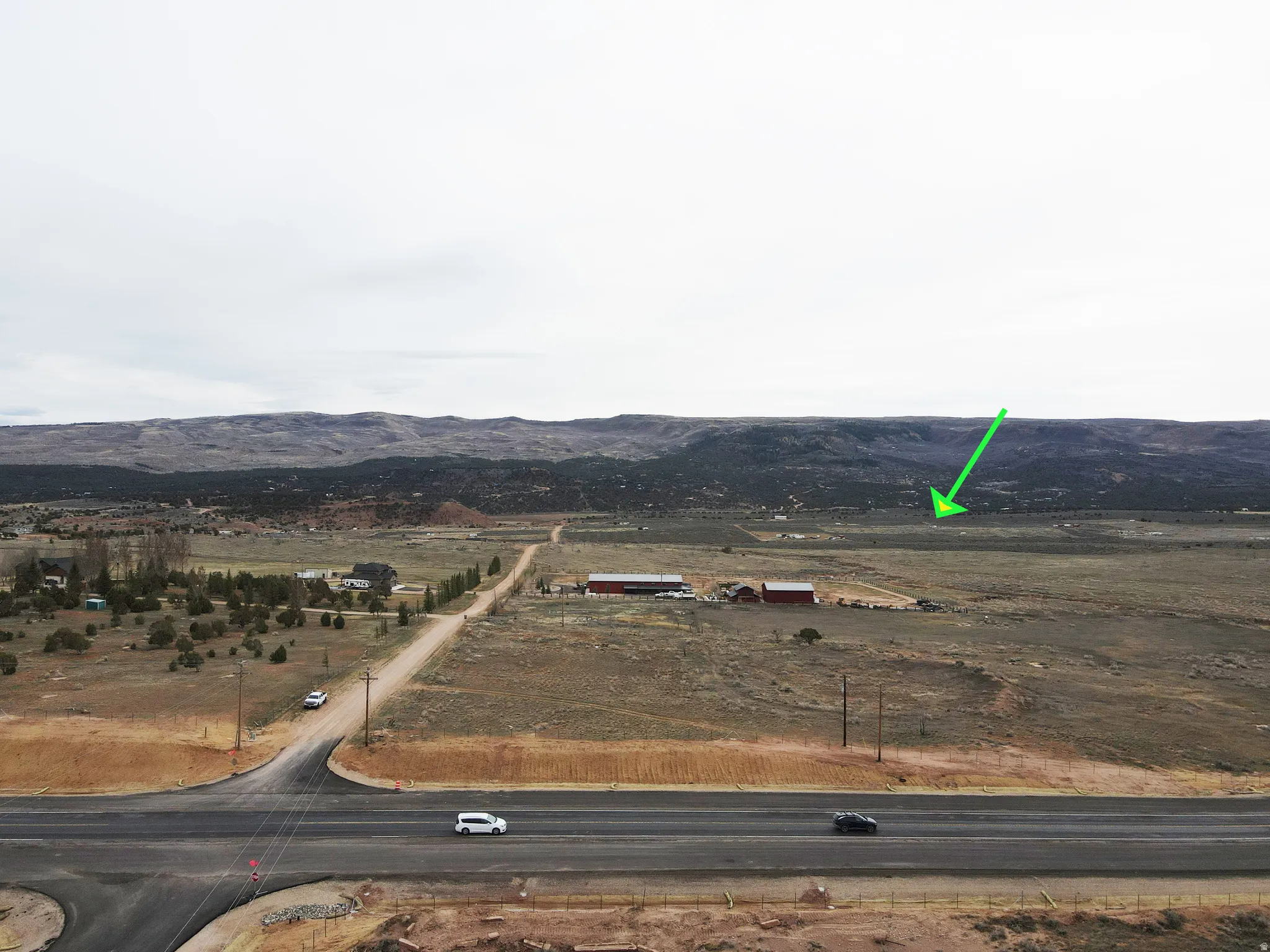 Overview of rural landscape featuring a mountain backdrop