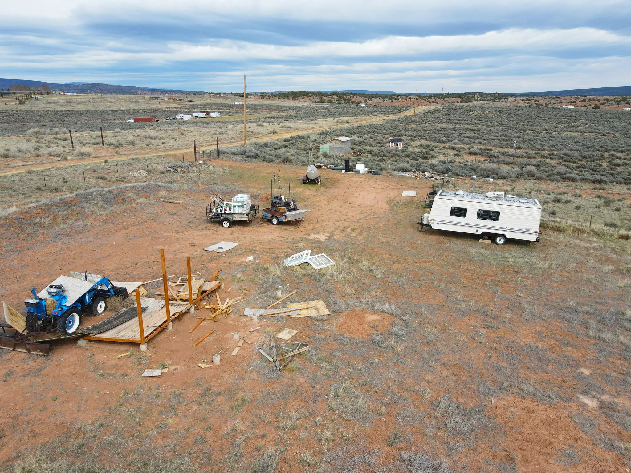 View of rural area featuring a mountainous background and a desert landscape
