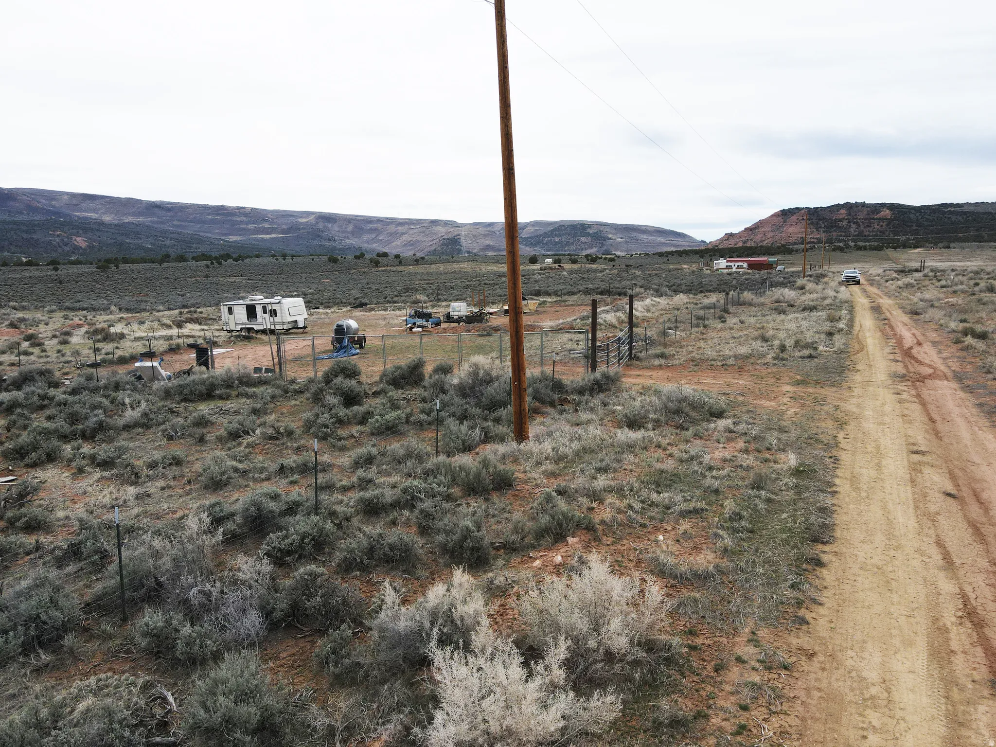 View of mountain backdrop with rural landscape
