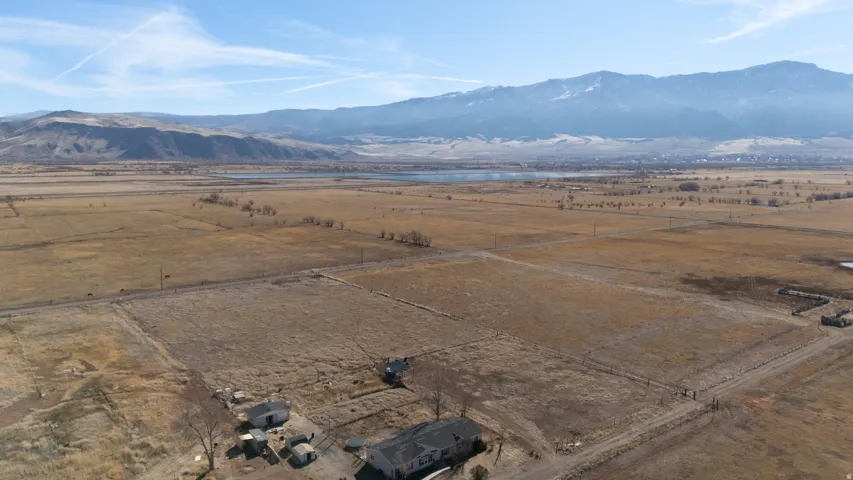 Aerial view of sparsely populated area with a water and mountain view