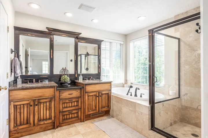 Full bathroom with a shower stall, double vanity, a bath, recessed lighting, and light tile patterned floors