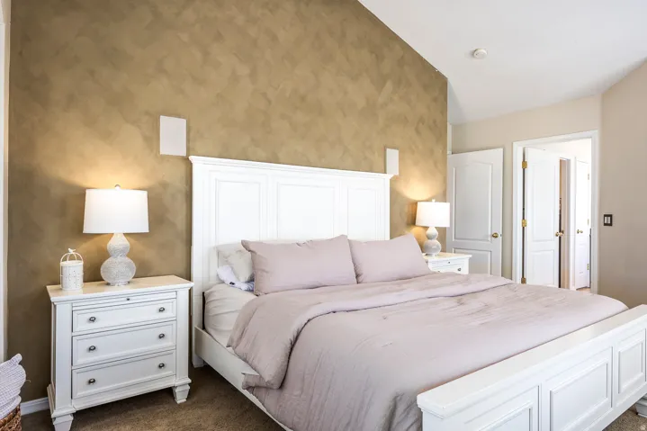 Bedroom featuring dark carpet