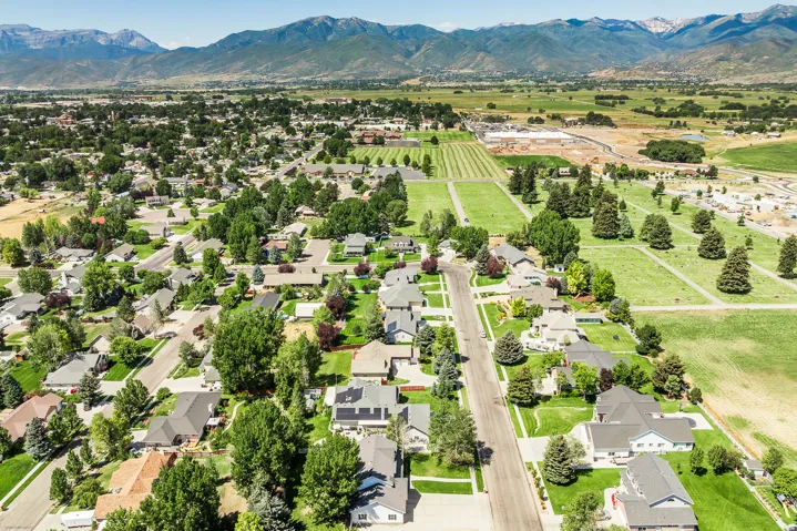 Aerial view of residential area featuring a mountain backdrop