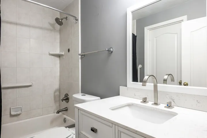 Full bathroom with vanity and bathing tub / shower combination