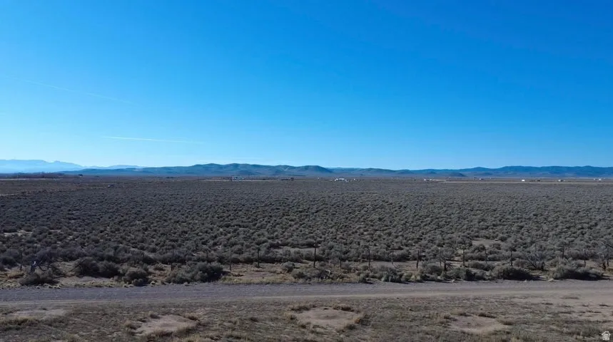 View of mountain backdrop featuring a desert landscape
