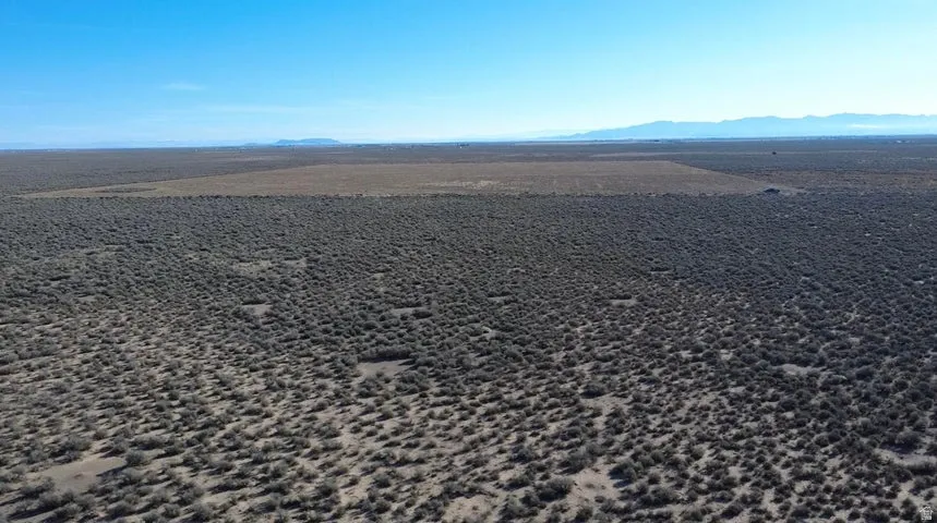 Aerial view of sparsely populated area featuring a mountain backdrop