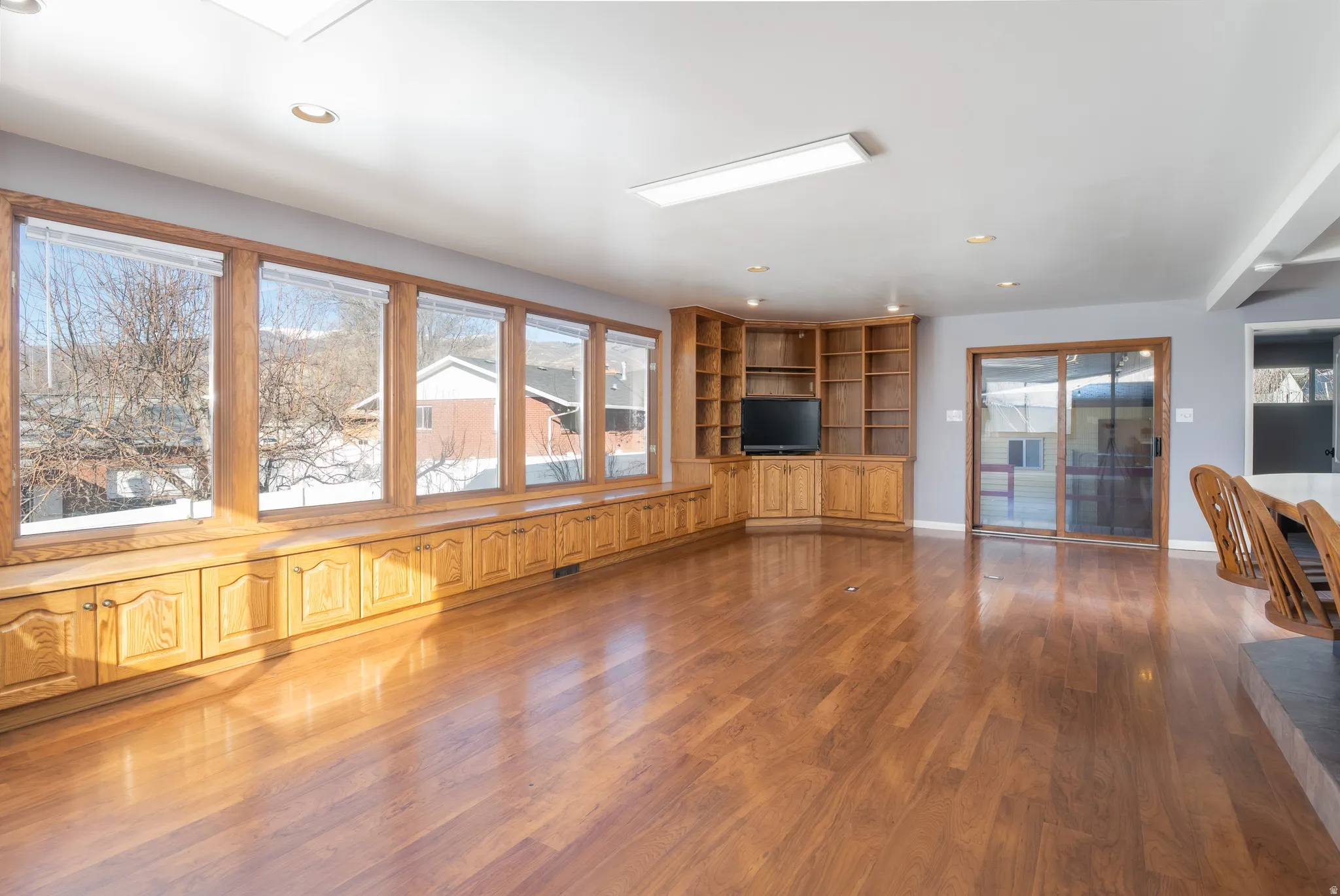 Great room addition with natural light and walkout to deck
