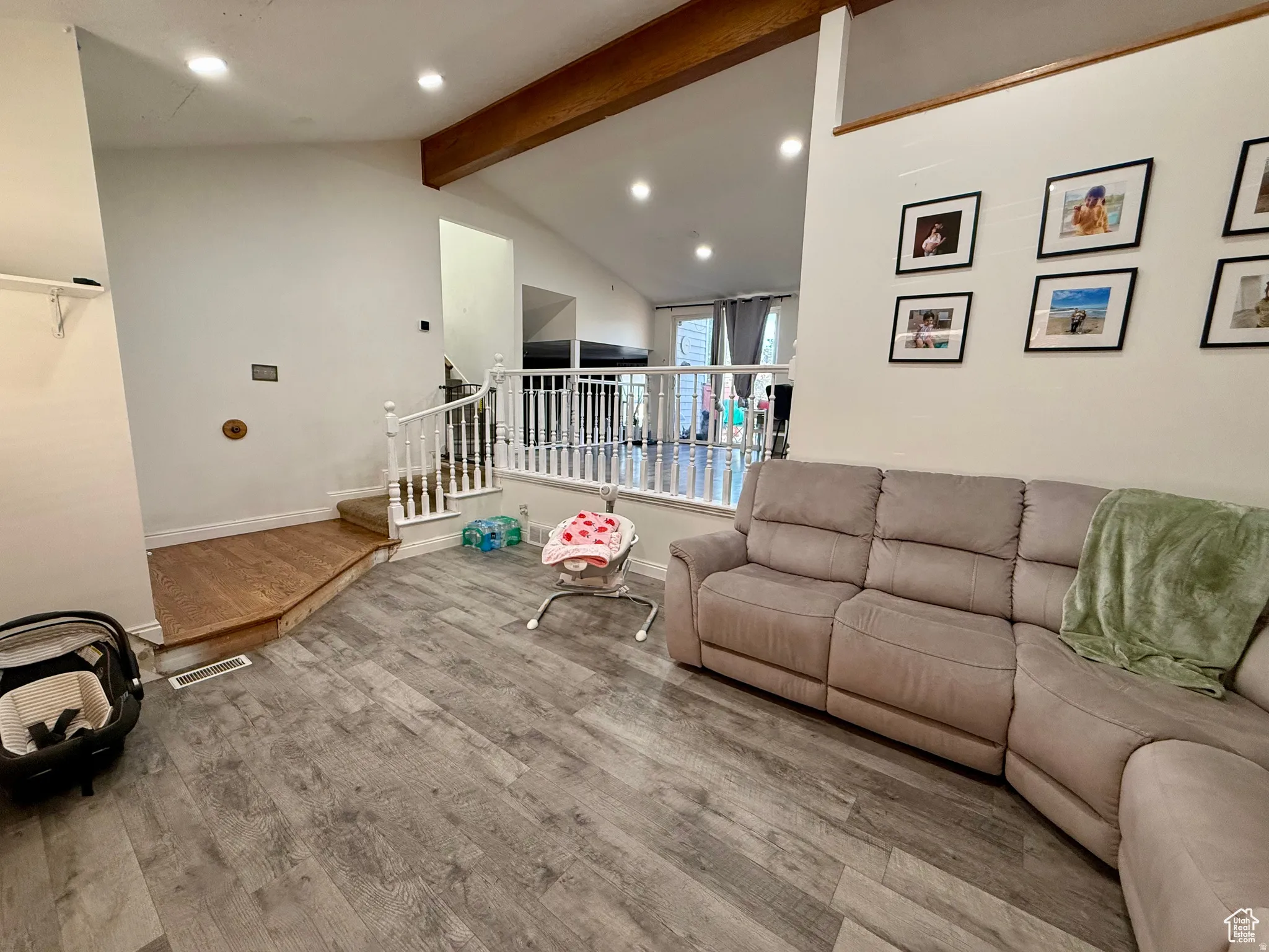Living area featuring recessed lighting, wood finished floors, and beamed ceiling