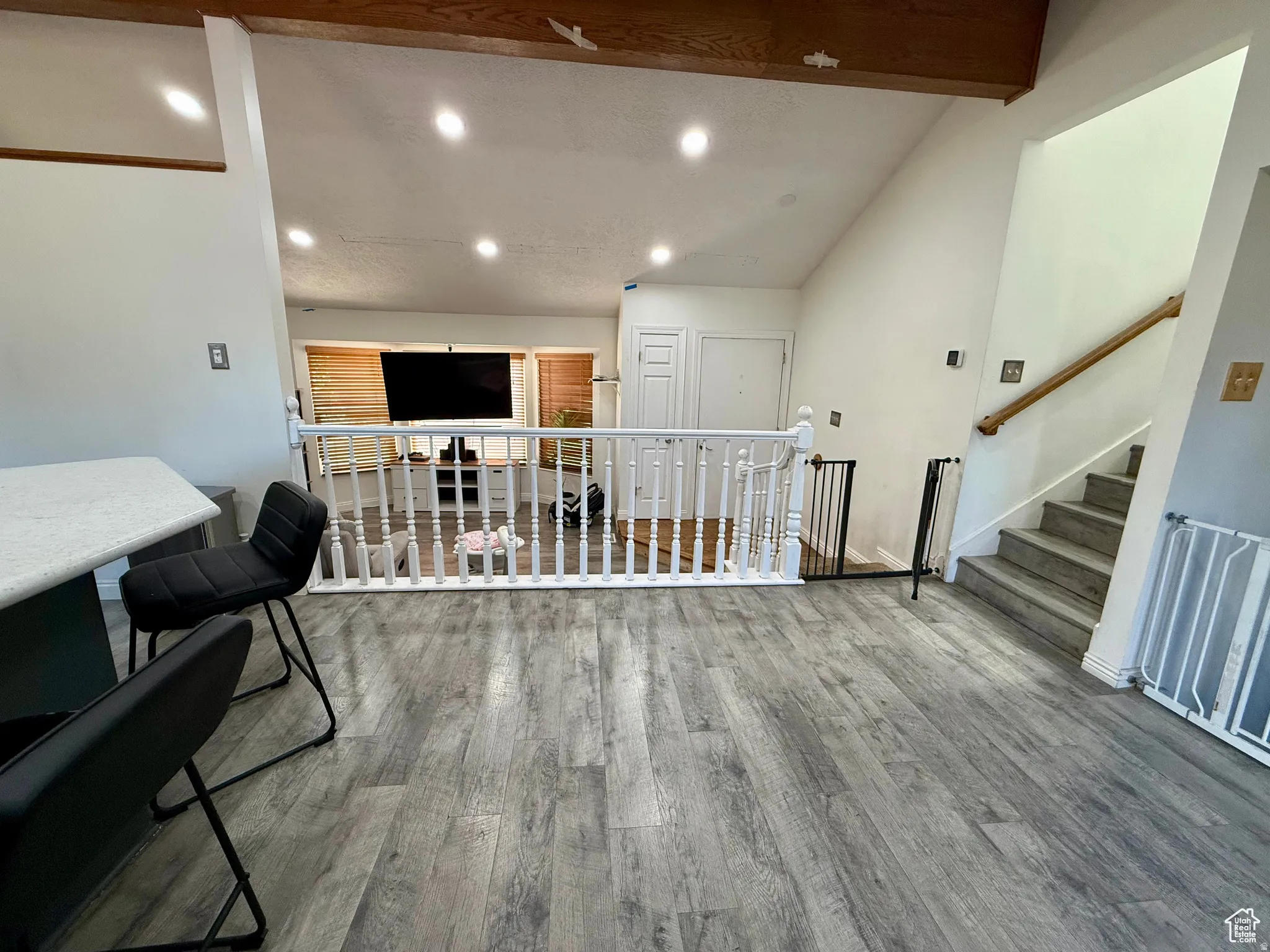 Interior space featuring lofted ceiling, recessed lighting, and light wood finished floors