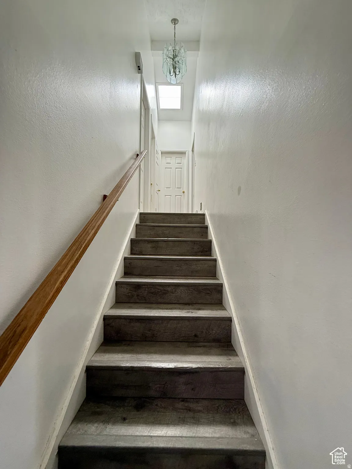 Stairs with a chandelier