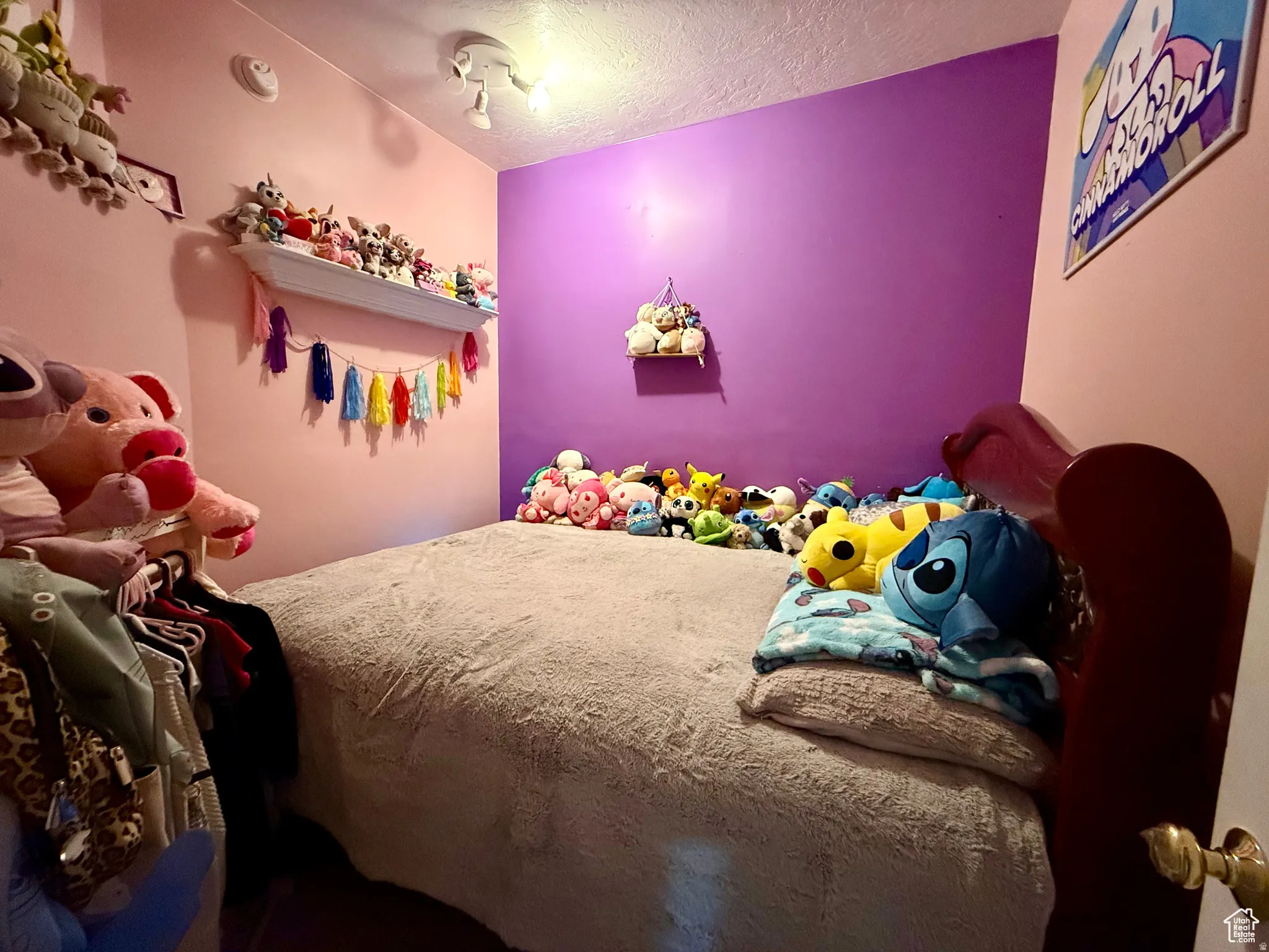 Bedroom with a textured ceiling