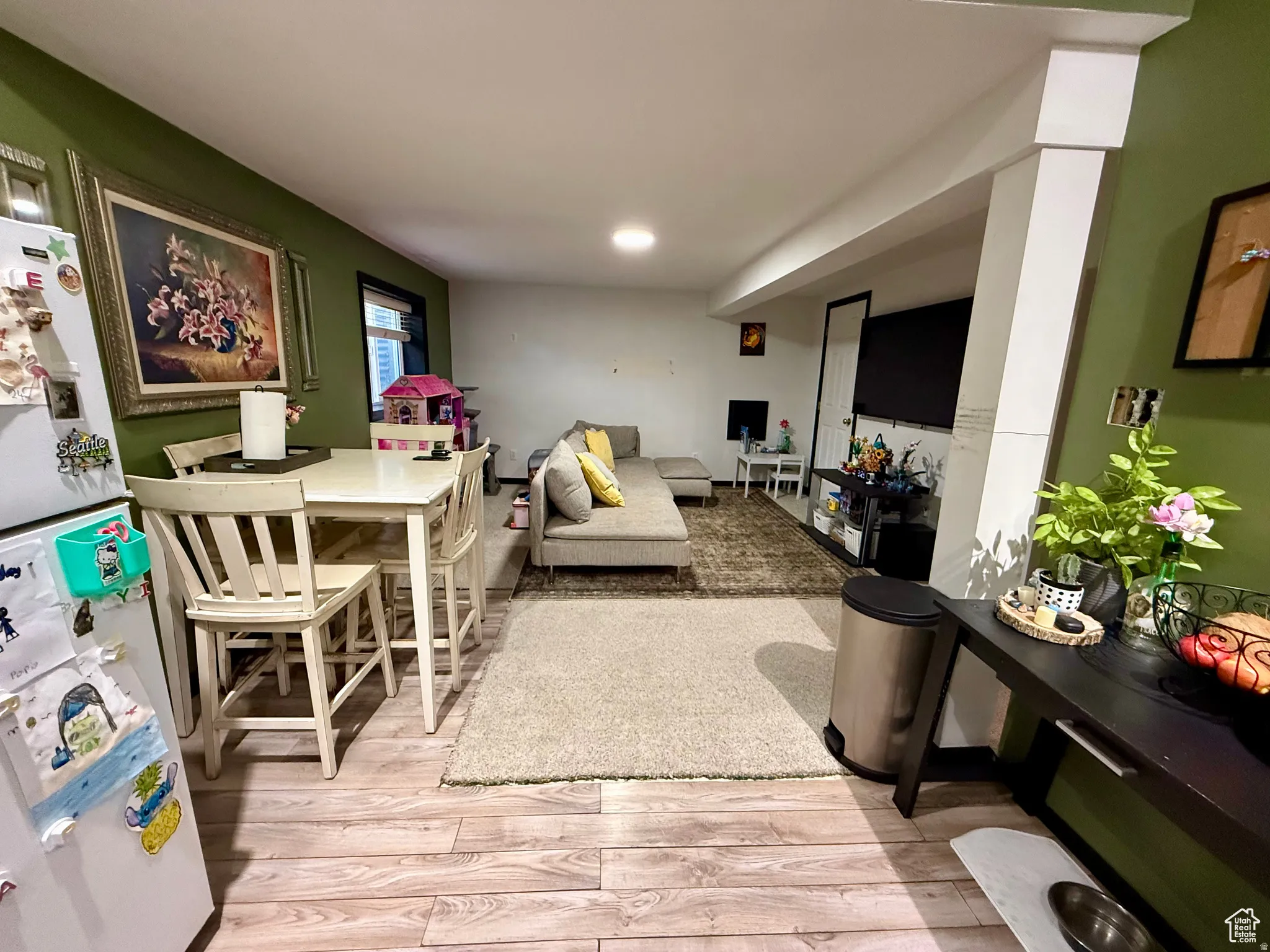 Living area with light wood finished floors