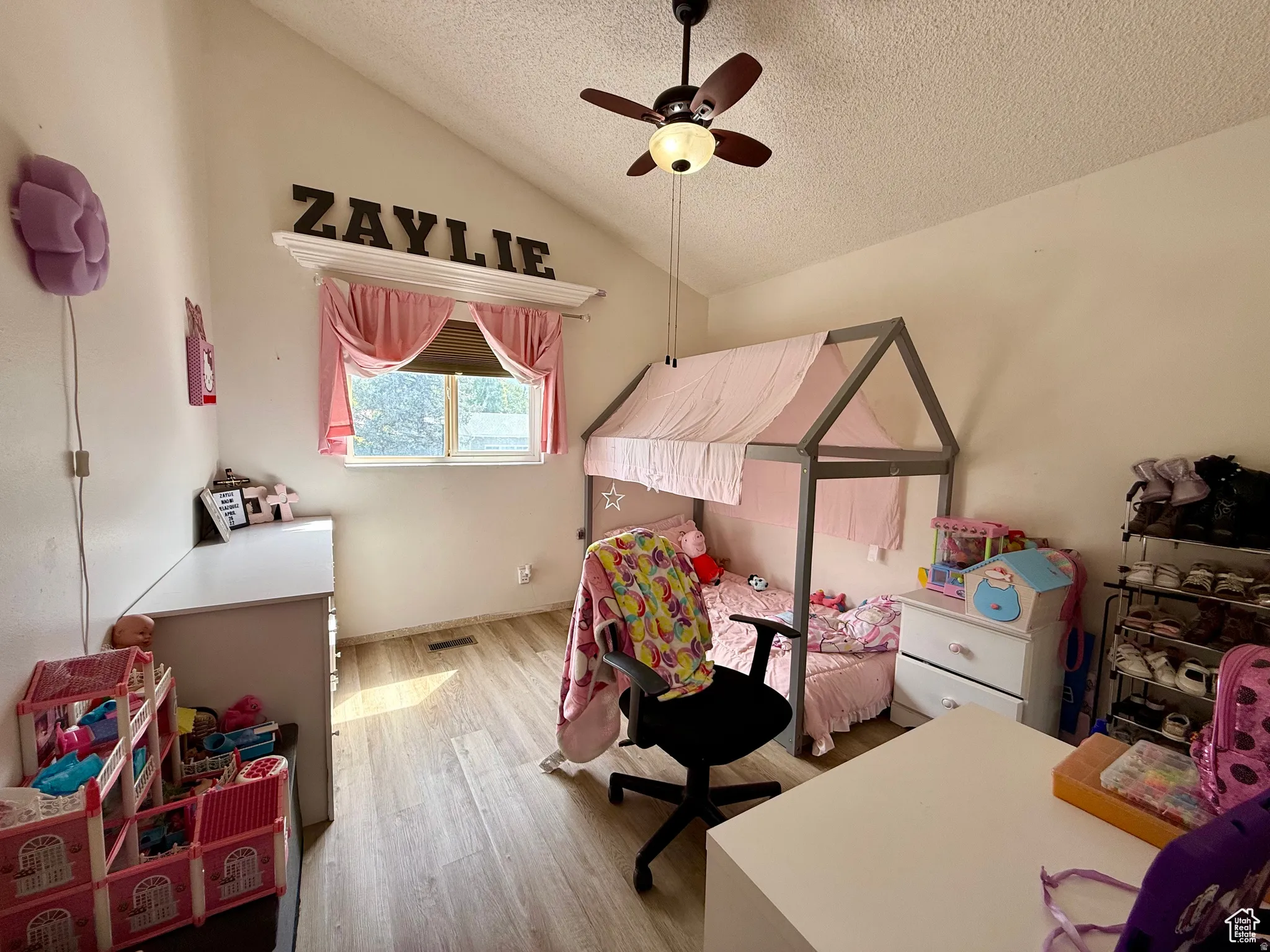 Bedroom featuring light wood-type flooring and a ceiling fan