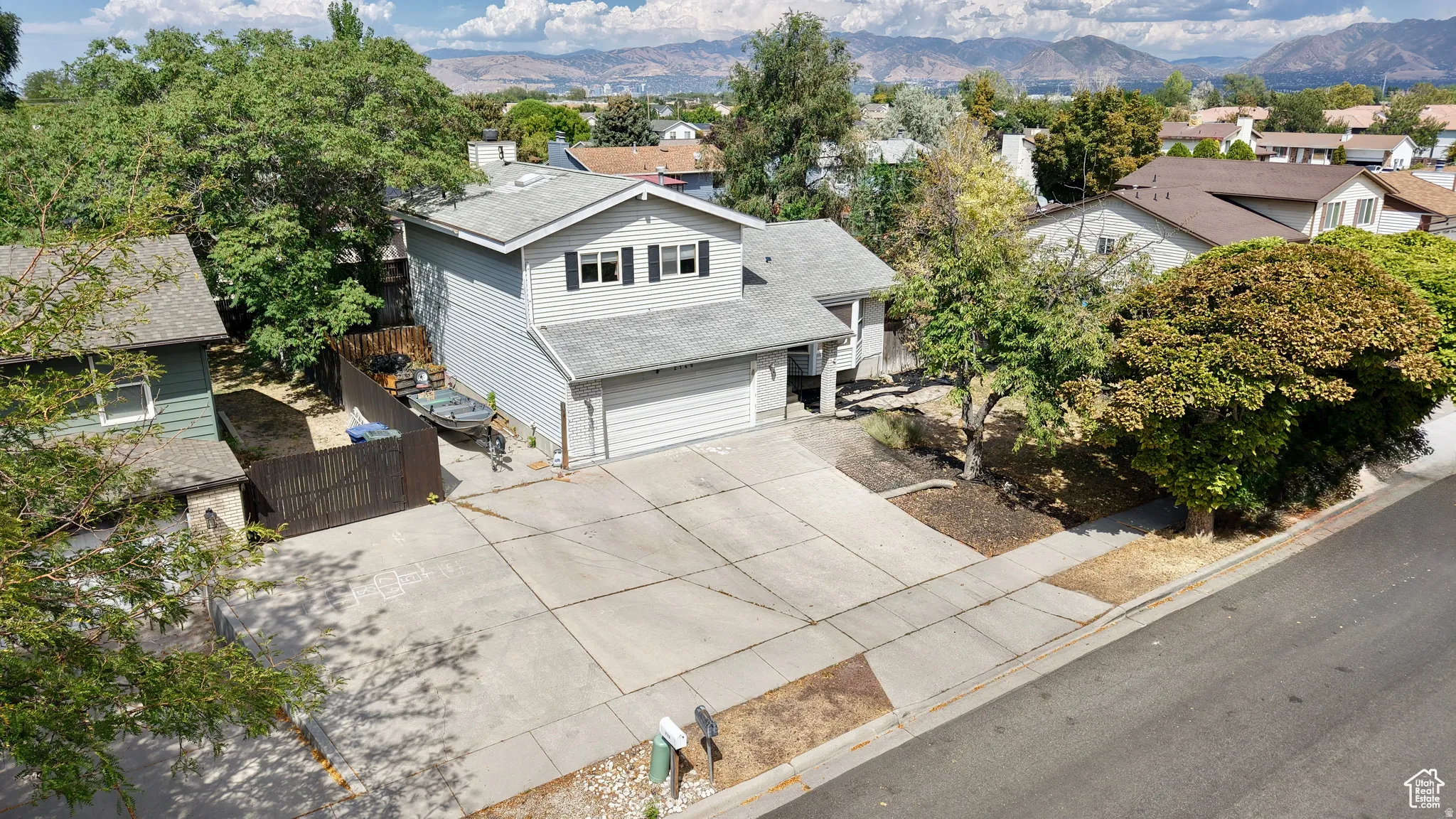 Aerial perspective of suburban area with a mountainous background
