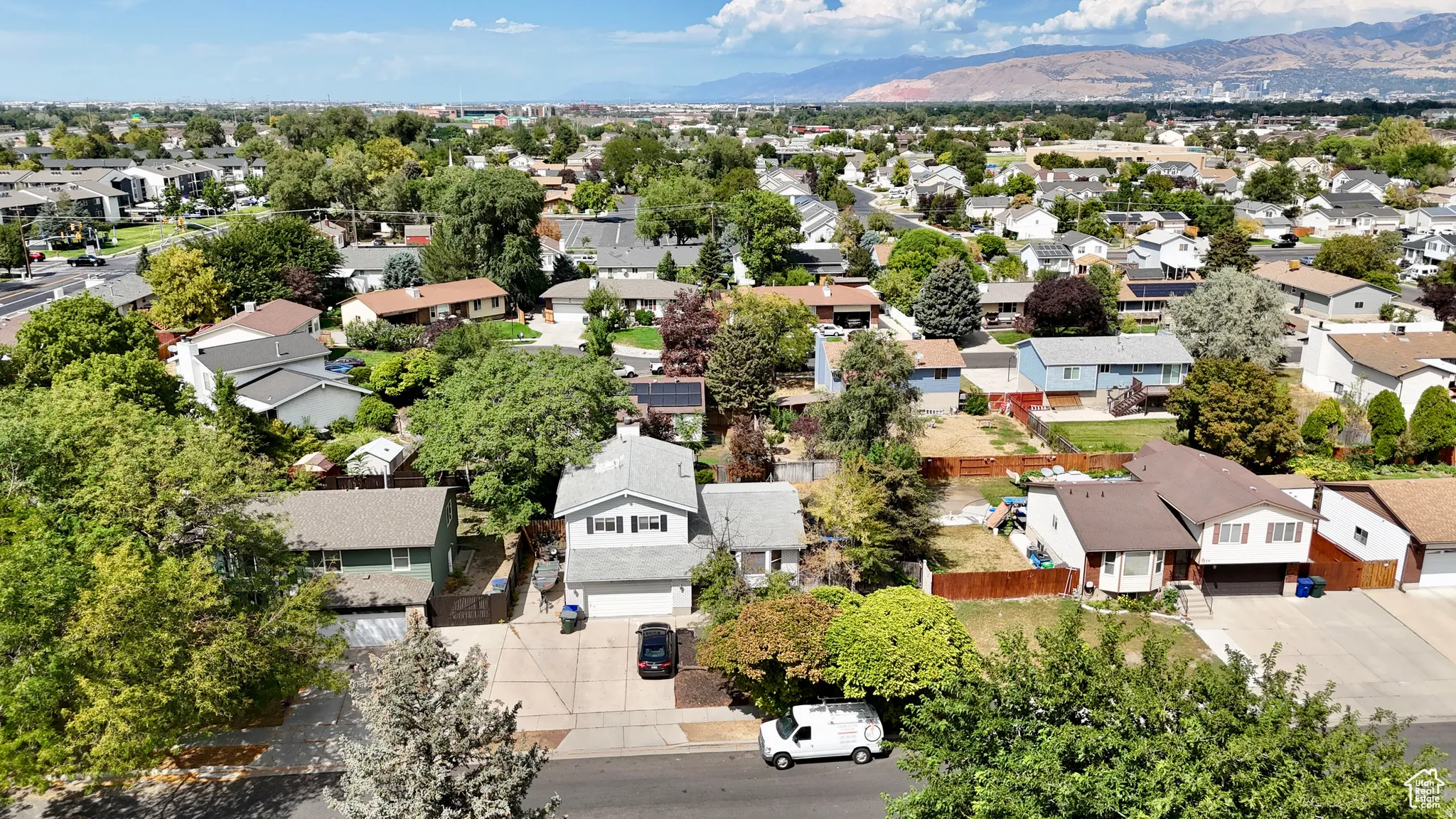 Aerial perspective of suburban area with a mountain backdrop
