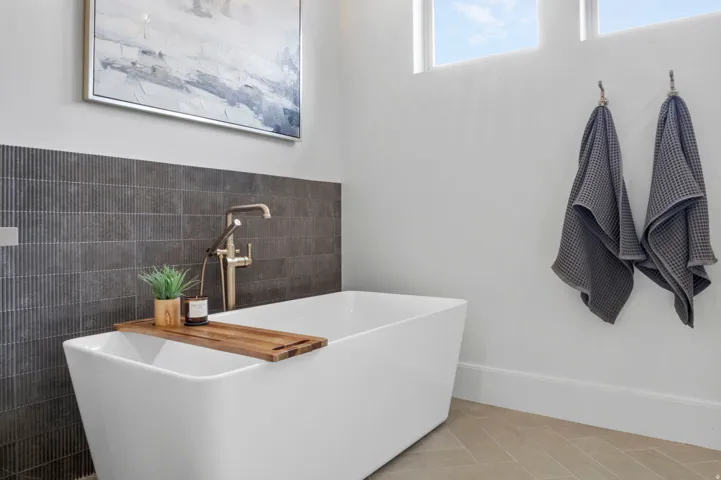 Bathroom with a soaking tub and tile patterned floors