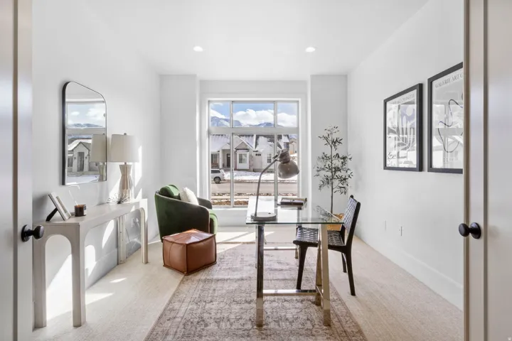 Carpeted office space with baseboards and recessed lighting