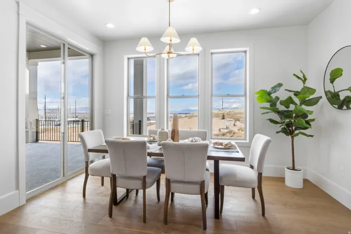 Dining room featuring light wood finished floors and hanging lights