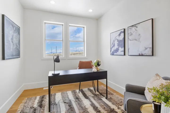 Office with light wood finished floors and baseboards