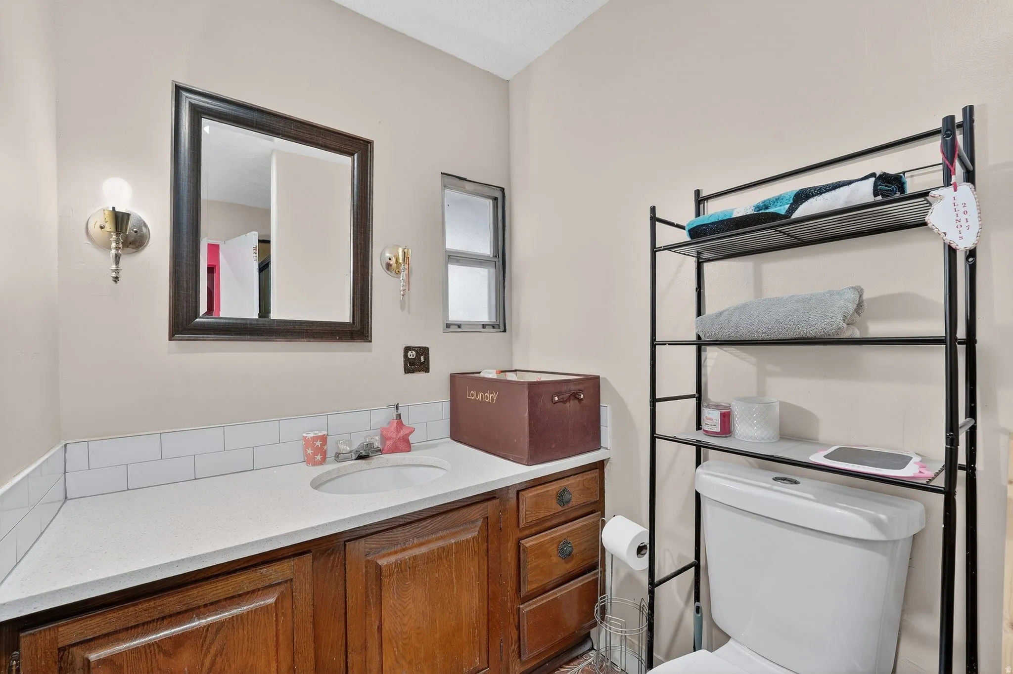 Half bathroom featuring toilet and vanity