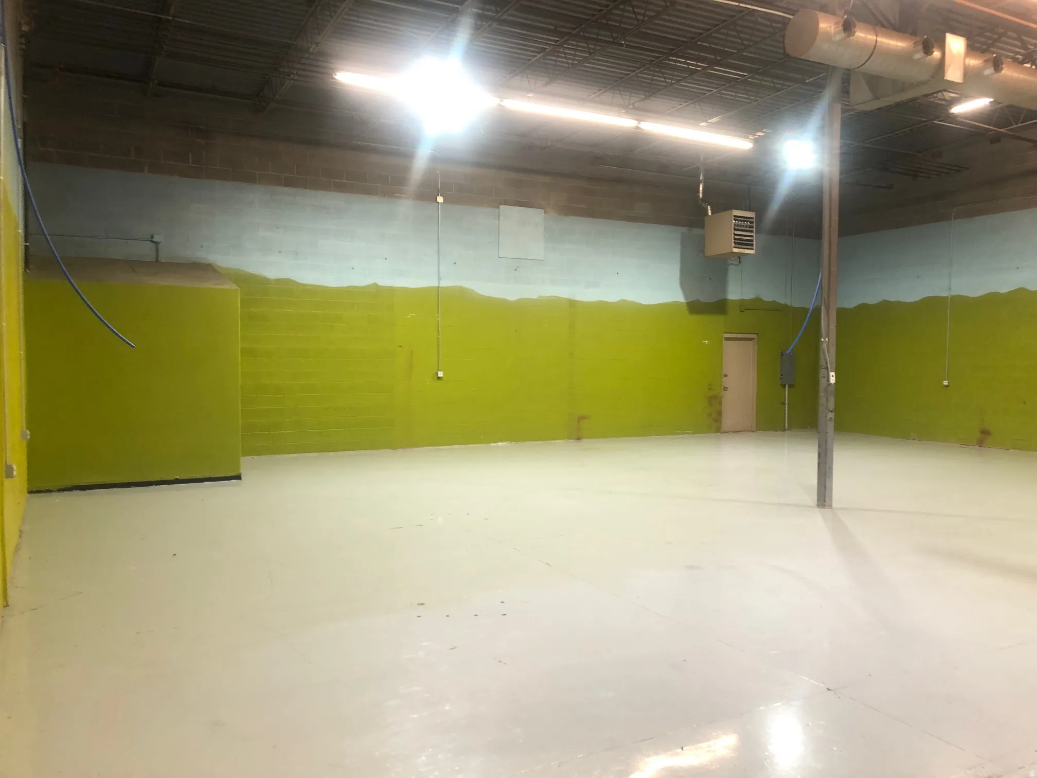 Garage featuring a heating unit