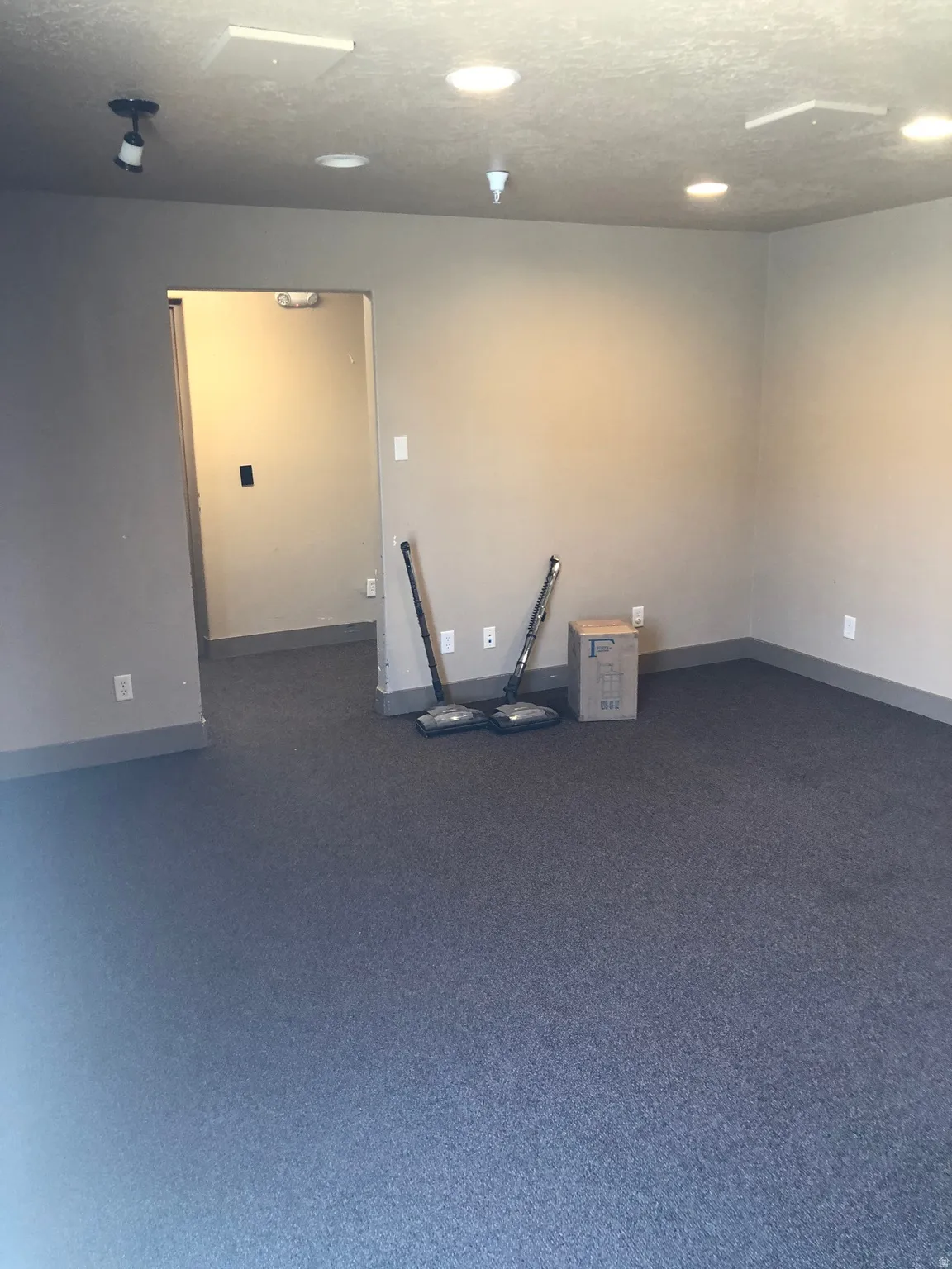 Unfurnished room with baseboards