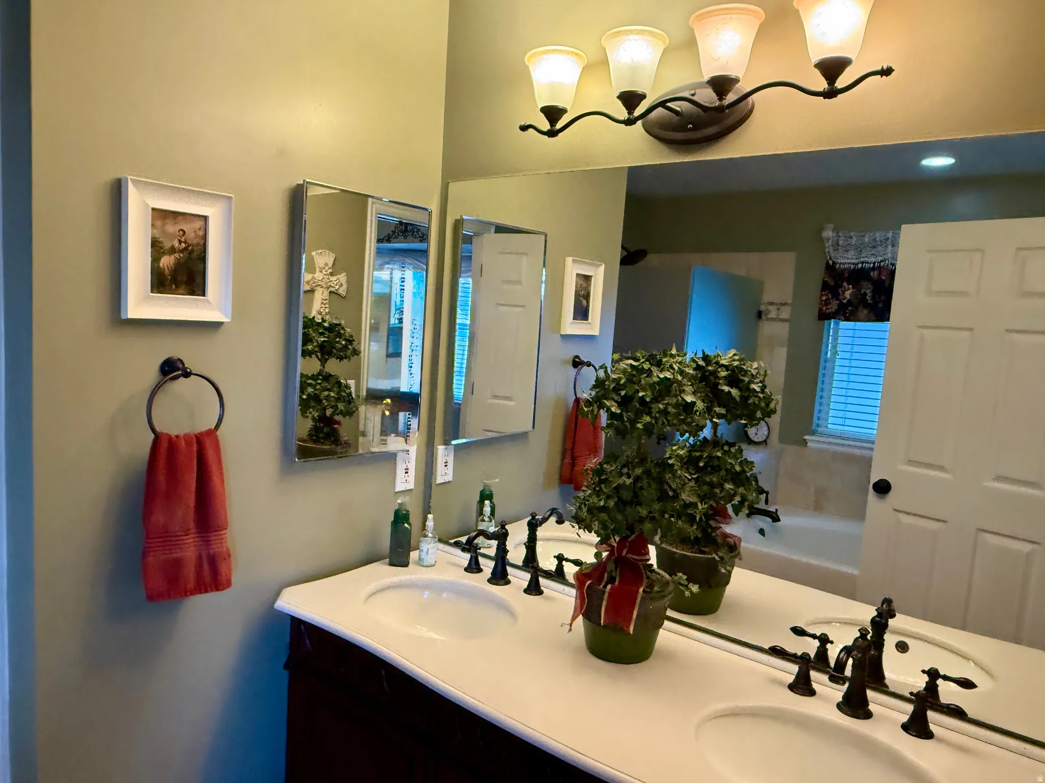 Bathroom with double vanity and a garden tub