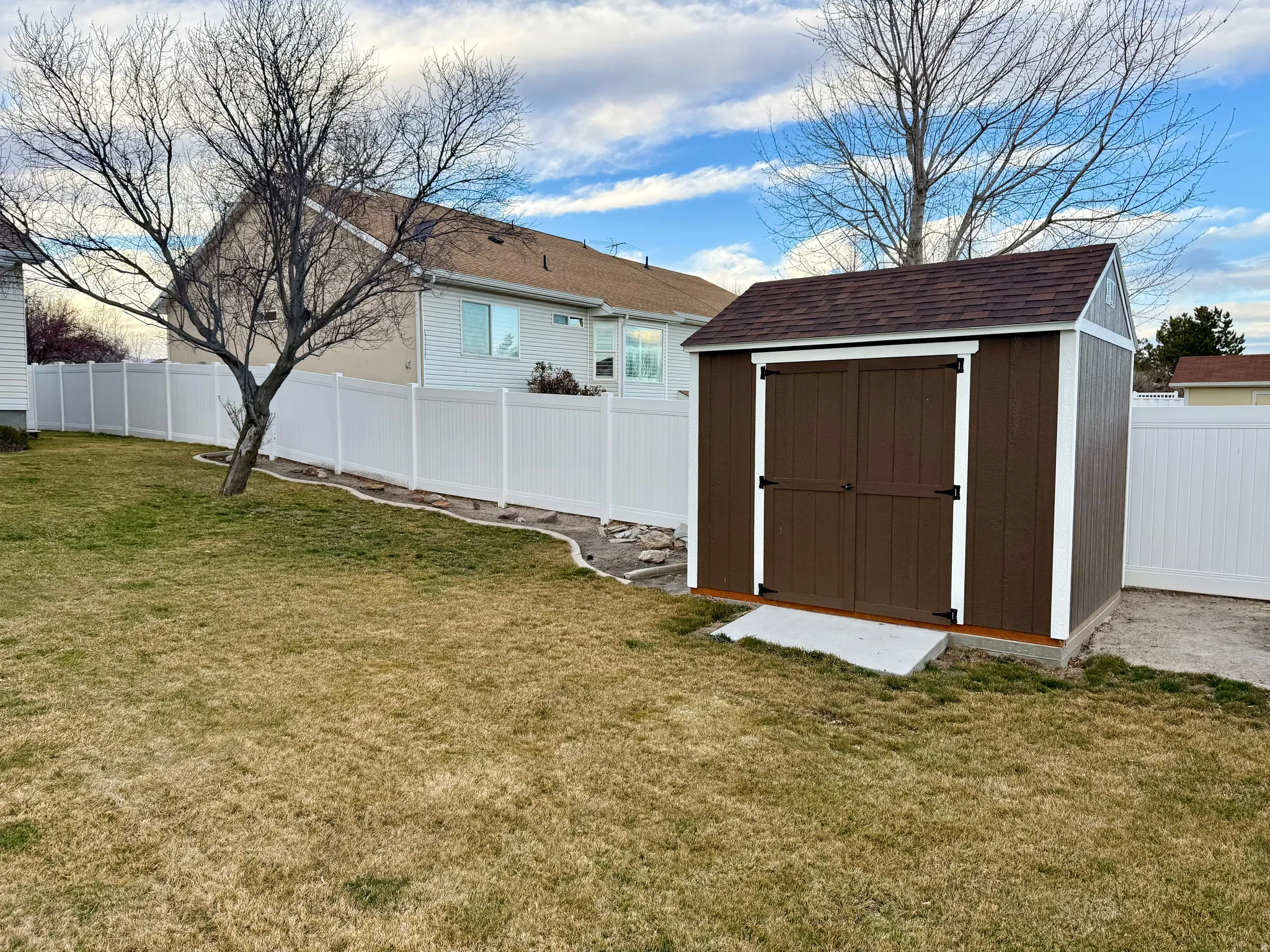 View of shed featuring a fenced backyard