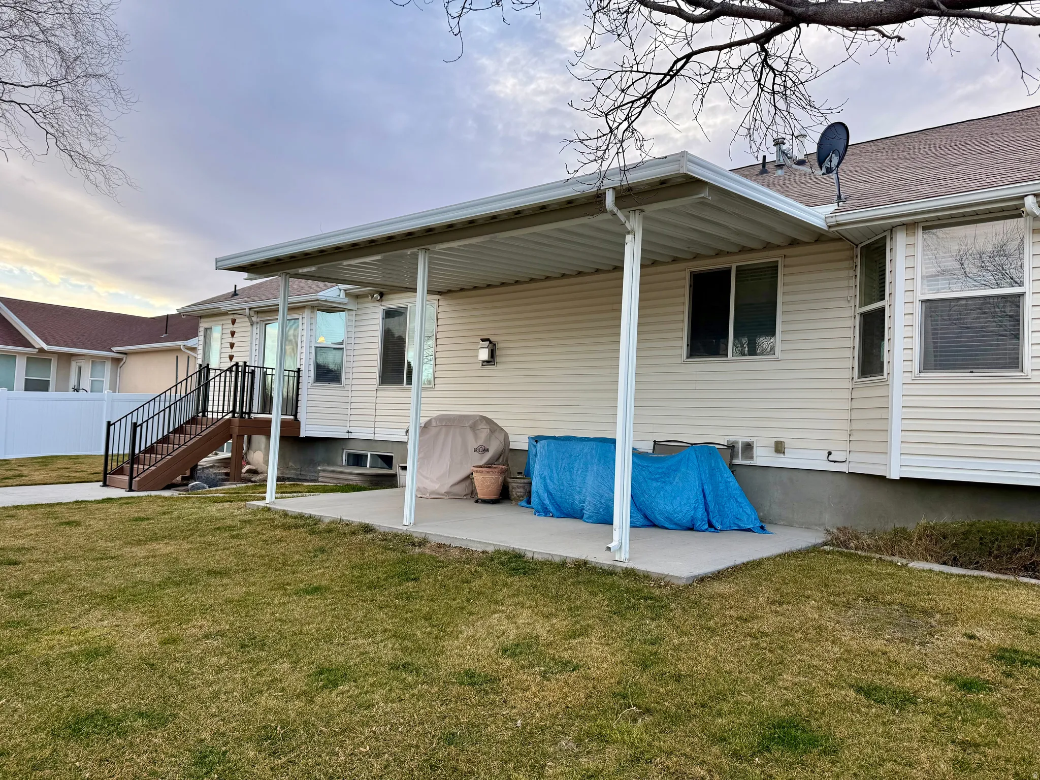 Back of house with a patio