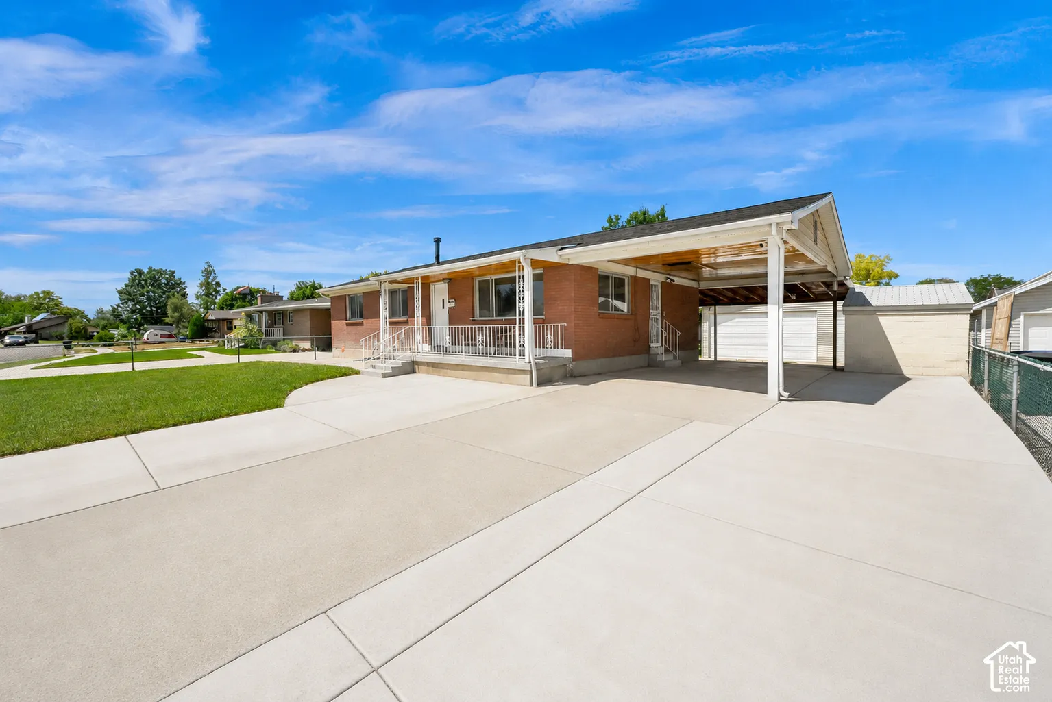 Brick exterior with a covered carport