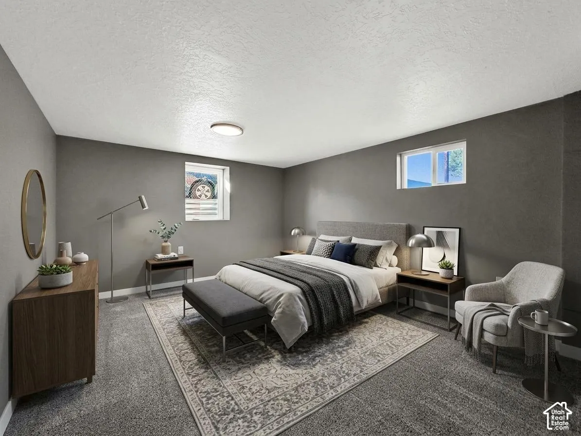 Wall-to-wall carpeting and neutral gray wall tones