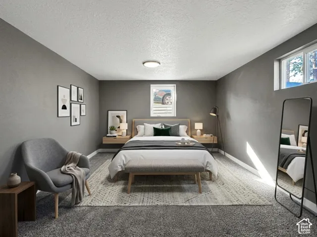 Grey textured walls with white trim, wall-mounted light fixture, and two windows