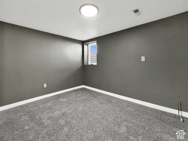 Recessed window, overhead flush-mount lighting, and wall-to-wall carpeting