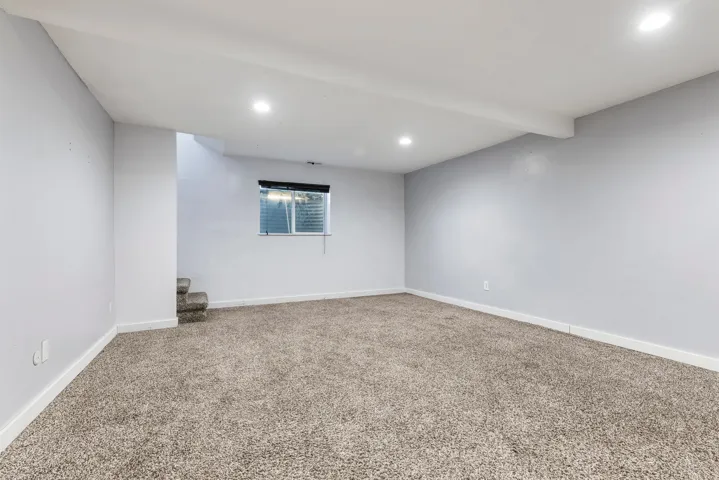 Below grade area featuring carpet flooring and recessed lighting