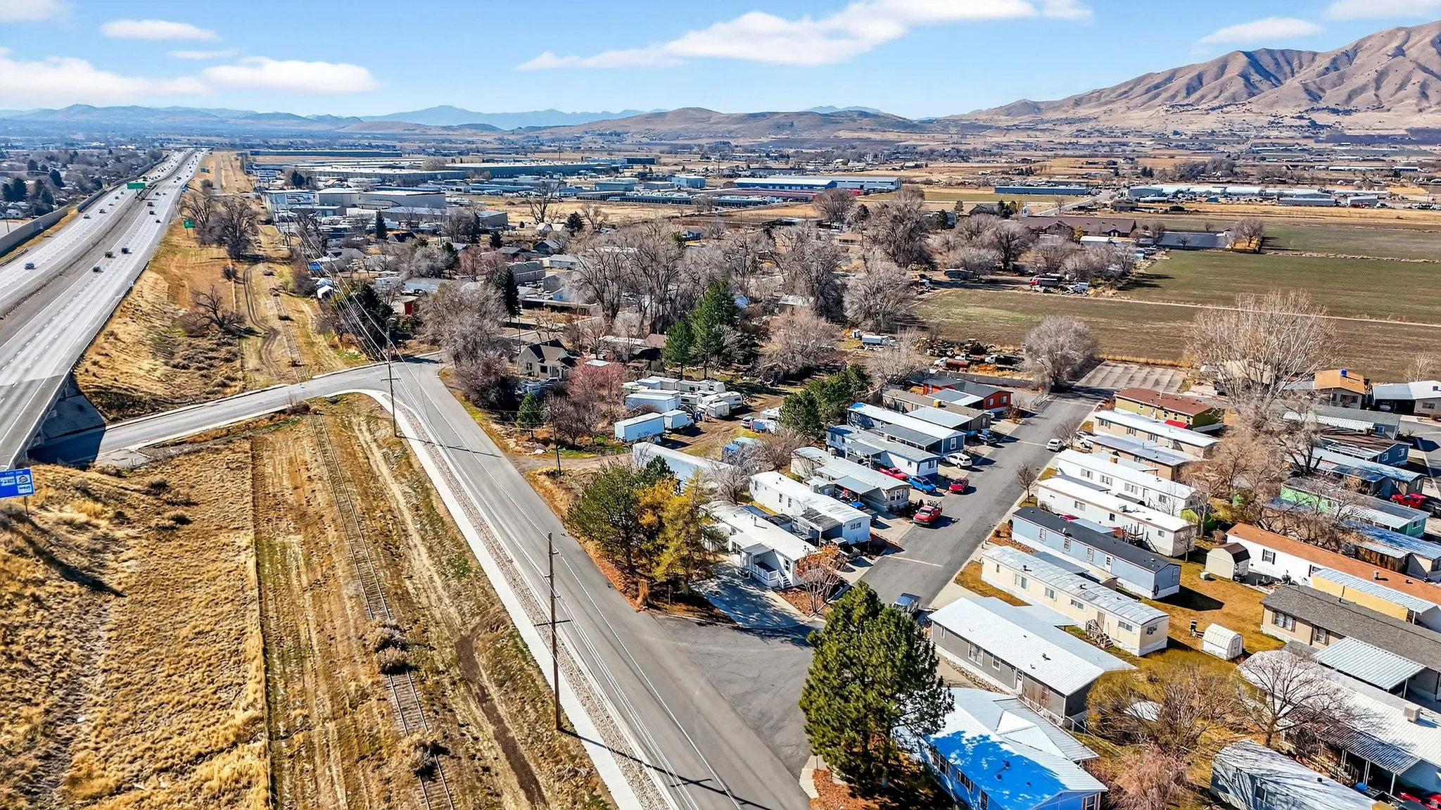 Aerial view of residential area featuring a mountain backdrop
