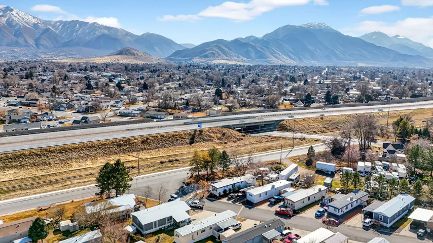 Aerial perspective of suburban area with a mountain backdrop
