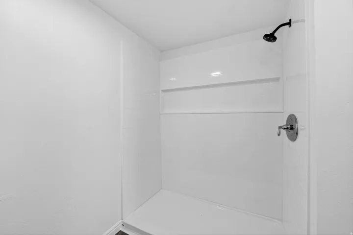 Full bathroom with a stall shower
