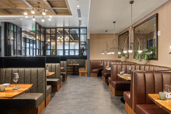 Community lobby with beam ceiling and recessed lighting