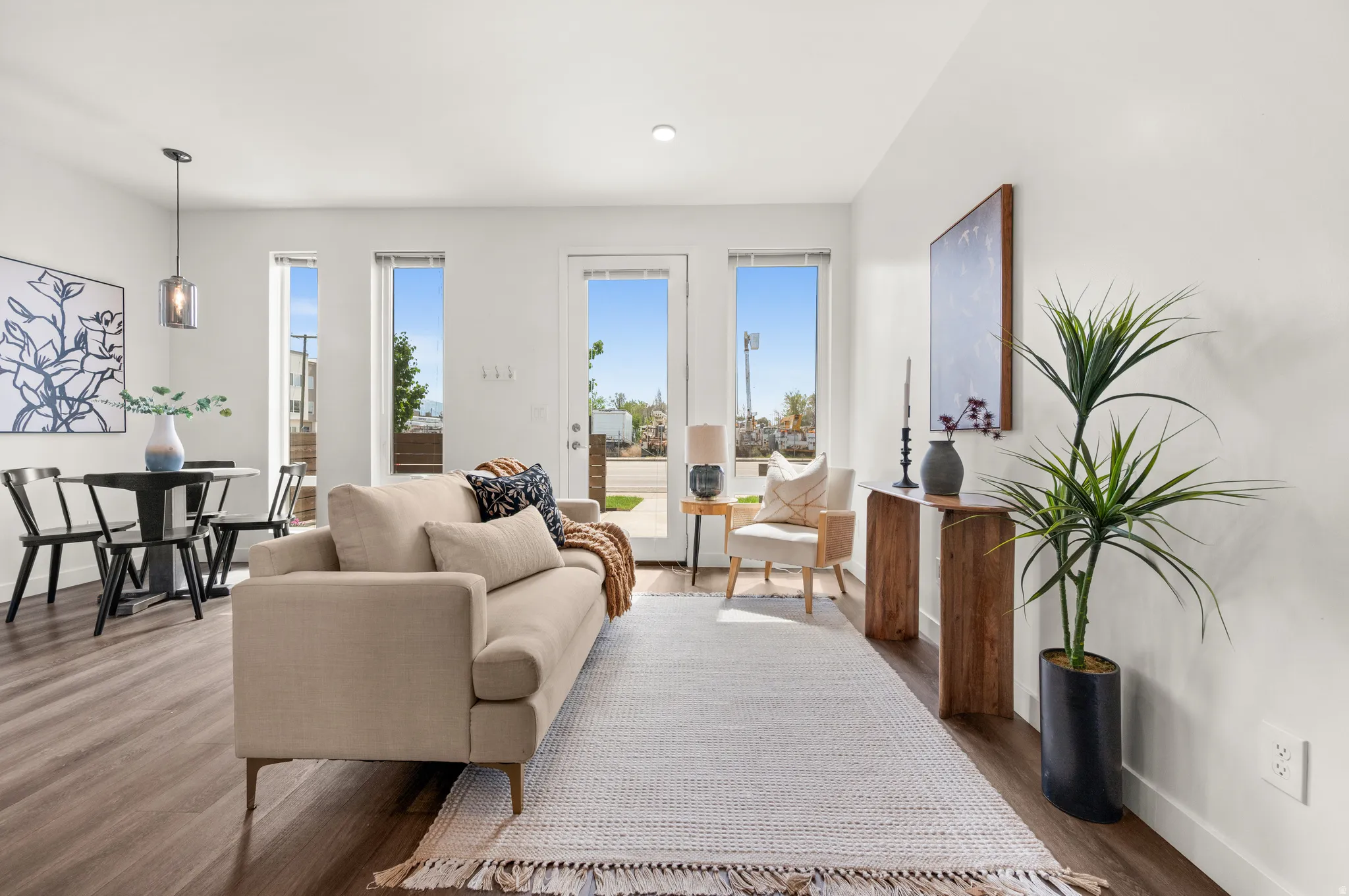 Living room with wood finished floors, healthy amount of natural light, and recessed lighting