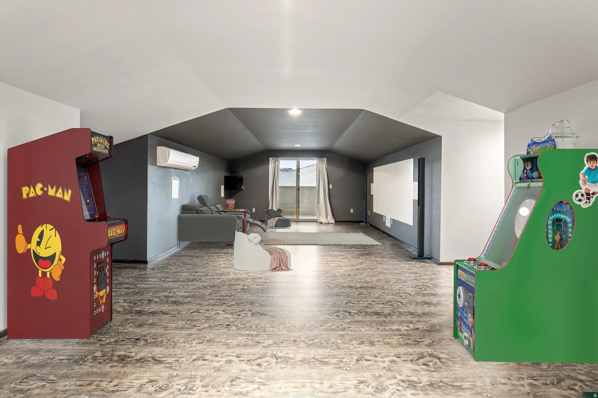 Playroom featuring wood finished floors and lofted ceiling