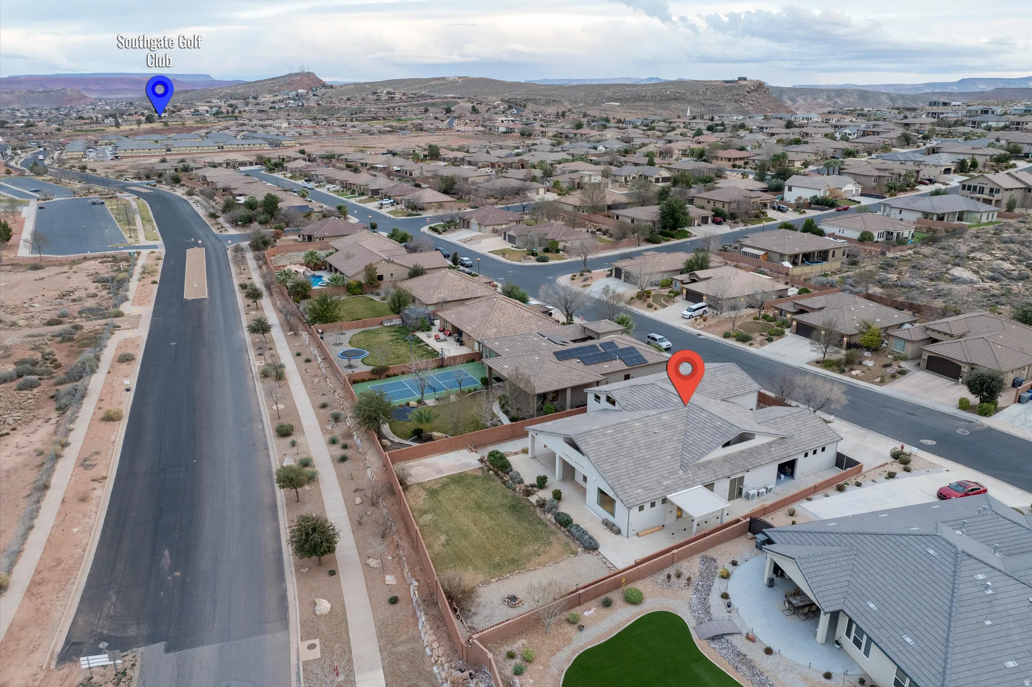 Aerial view of residential area with a mountainous background