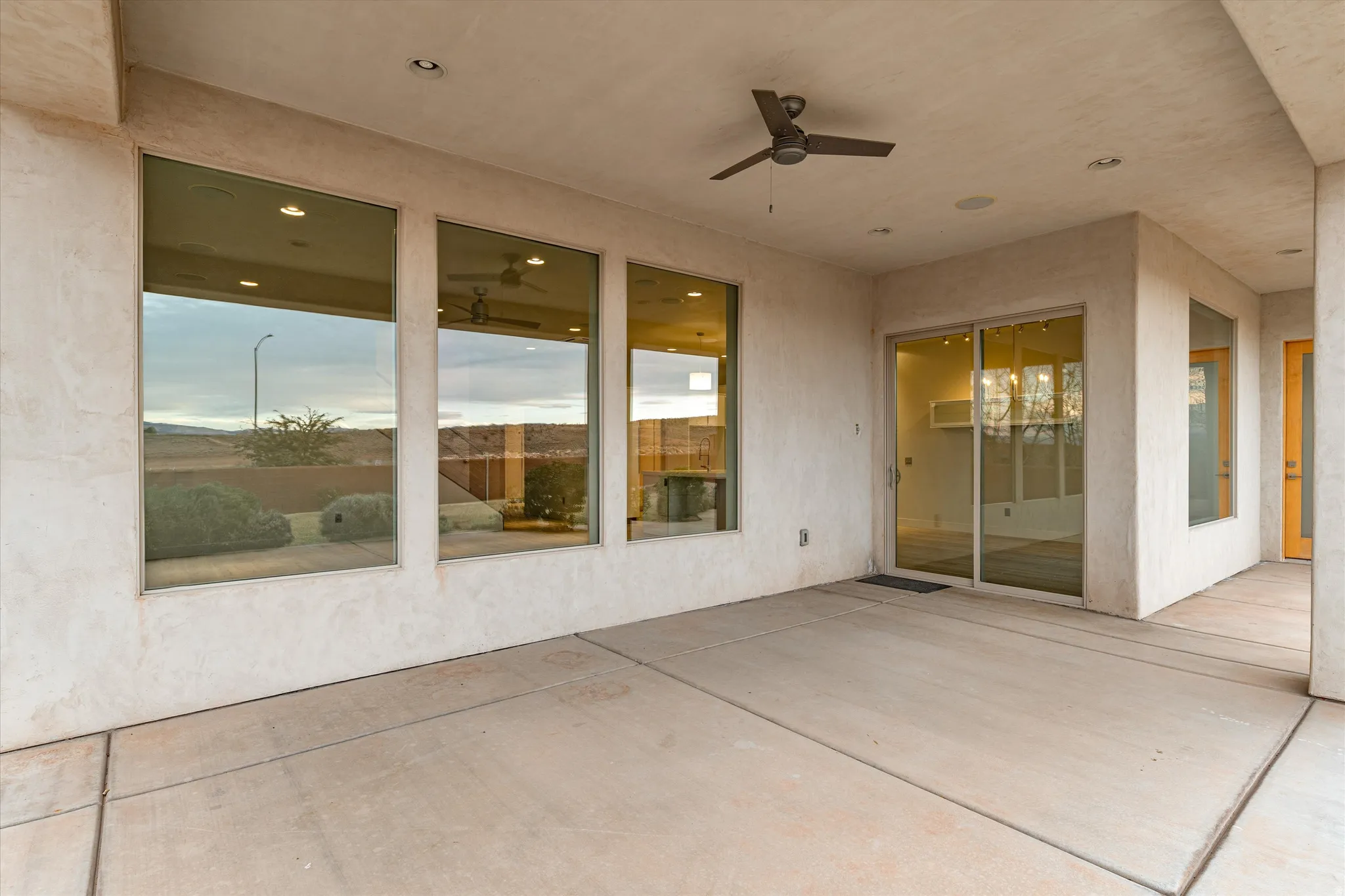 View of patio featuring ceiling fan