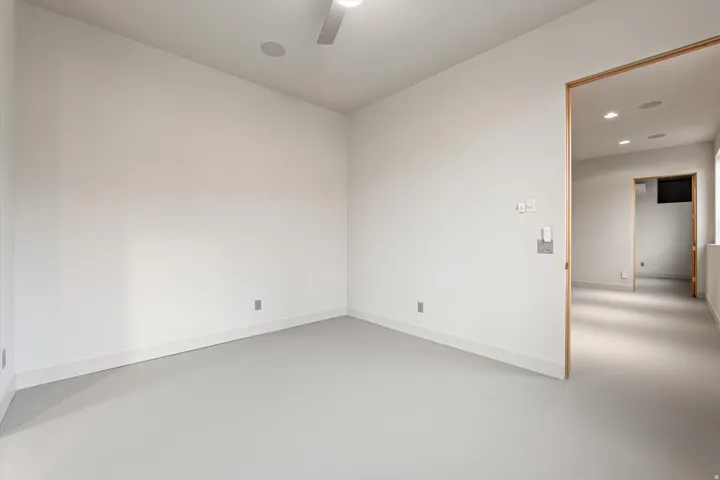 Spare room with concrete floors, recessed lighting, and a ceiling fan